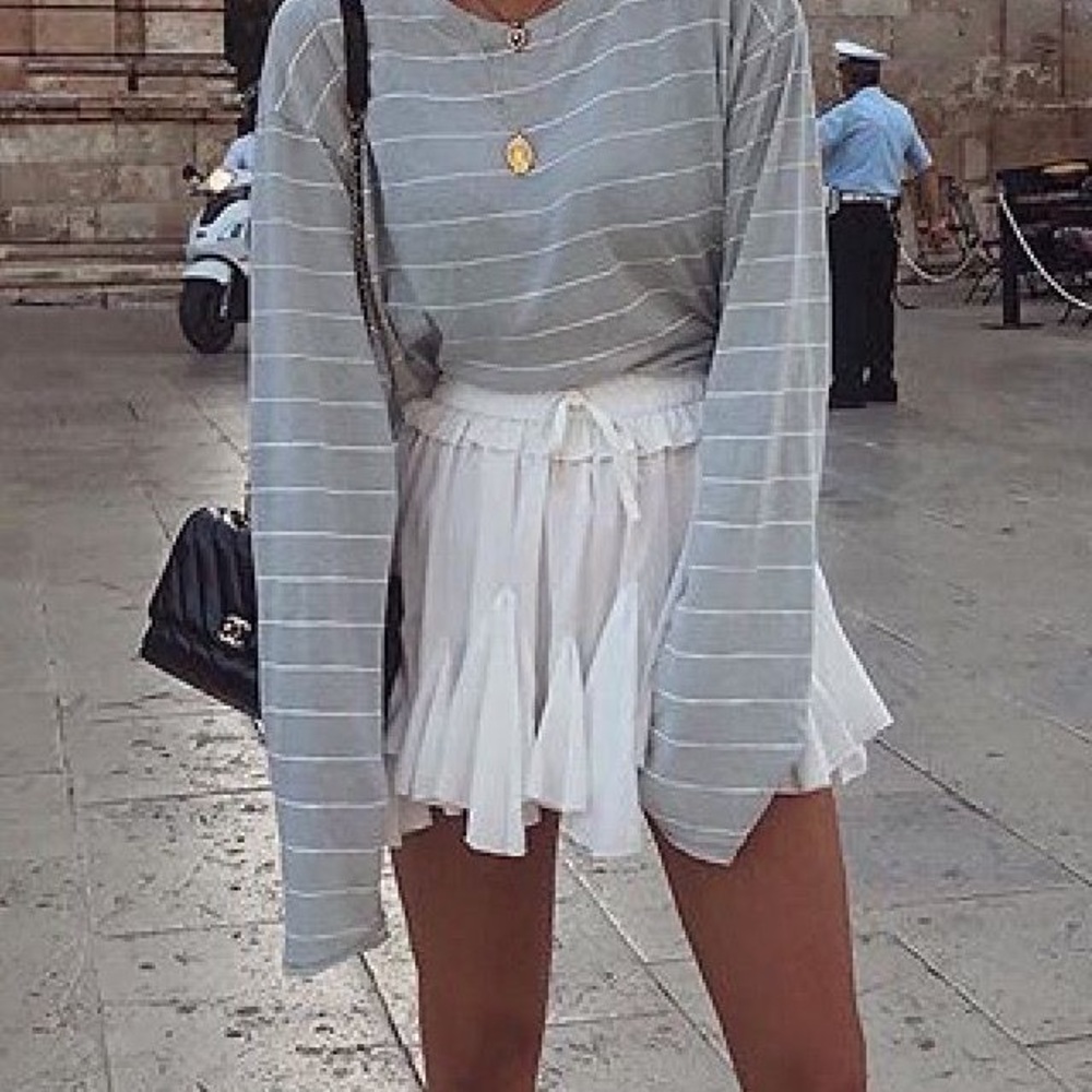 white mini storets skirt, has one stain